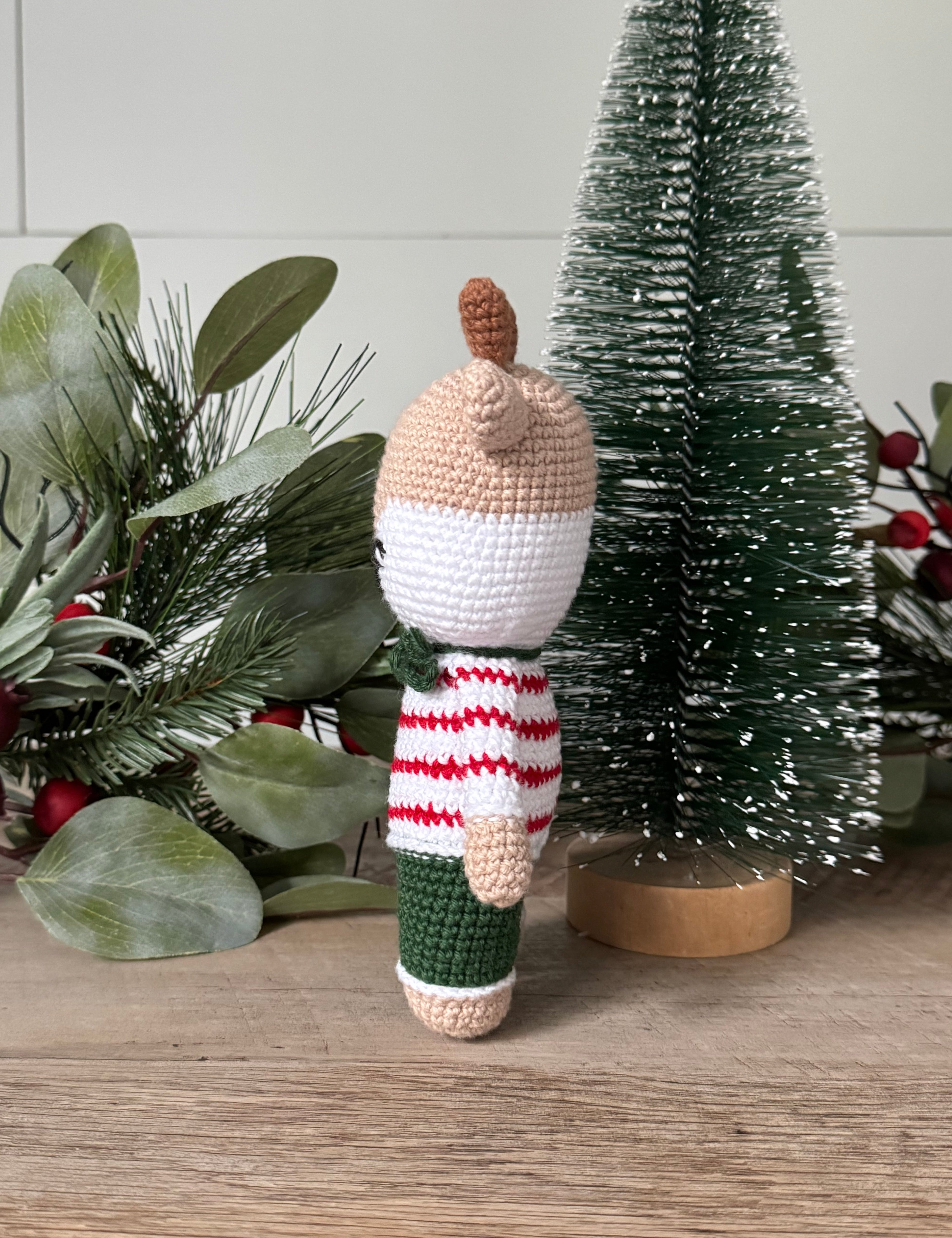 Side view of stuffed amigurumi reindeer.