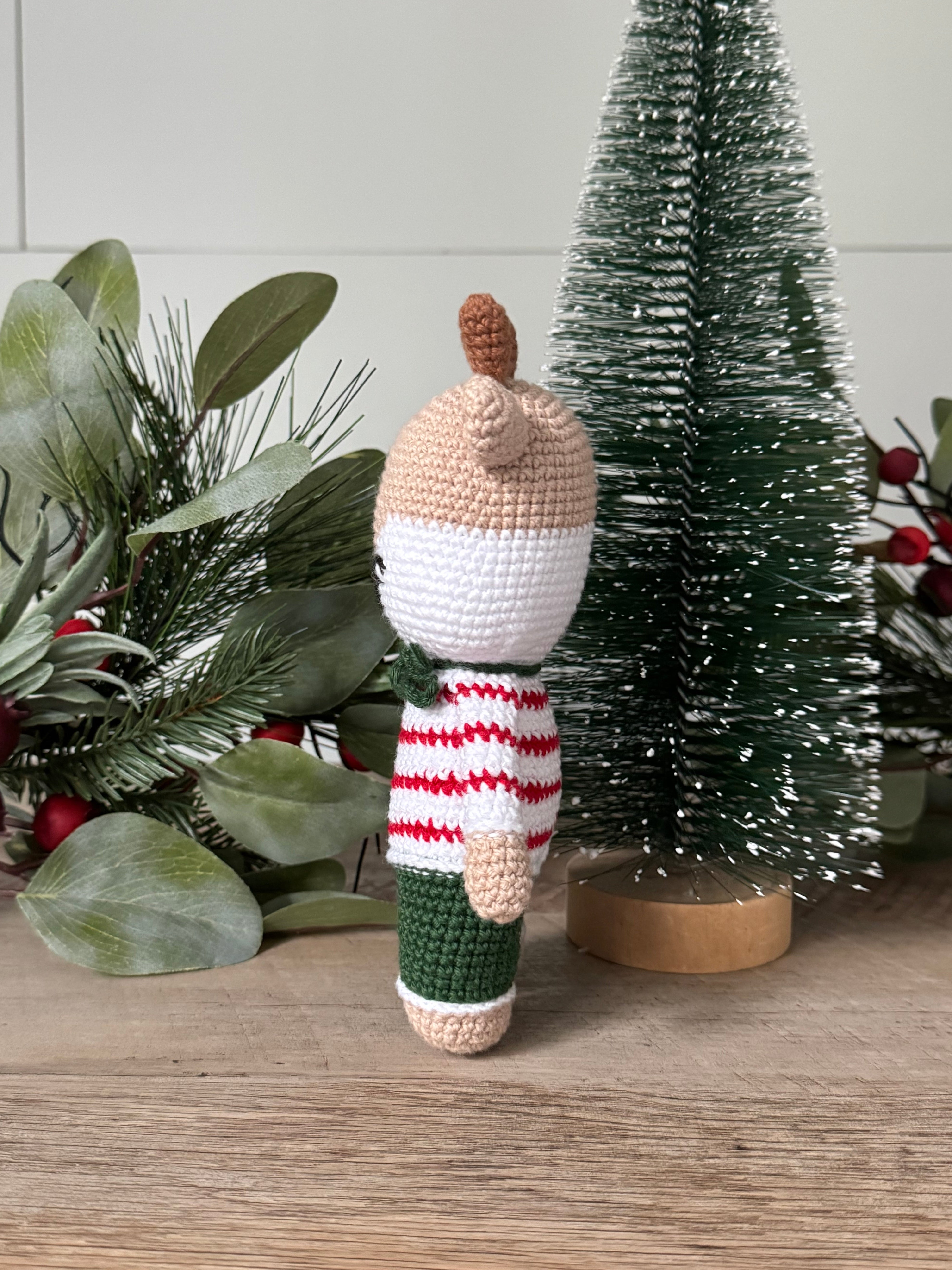 Side view of stuffed amigurumi reindeer.