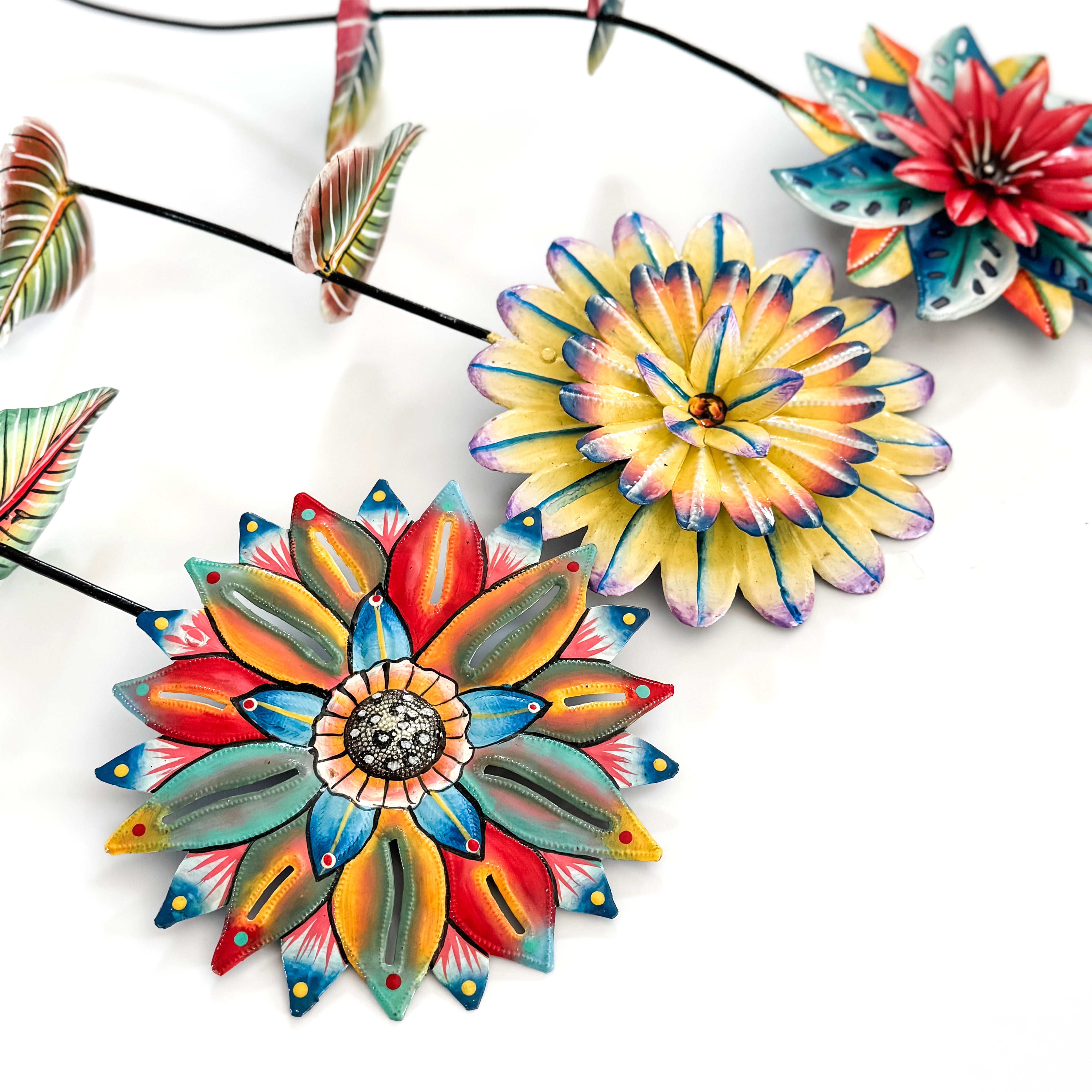 Colorful ceramic flower-shaped objects on a white background