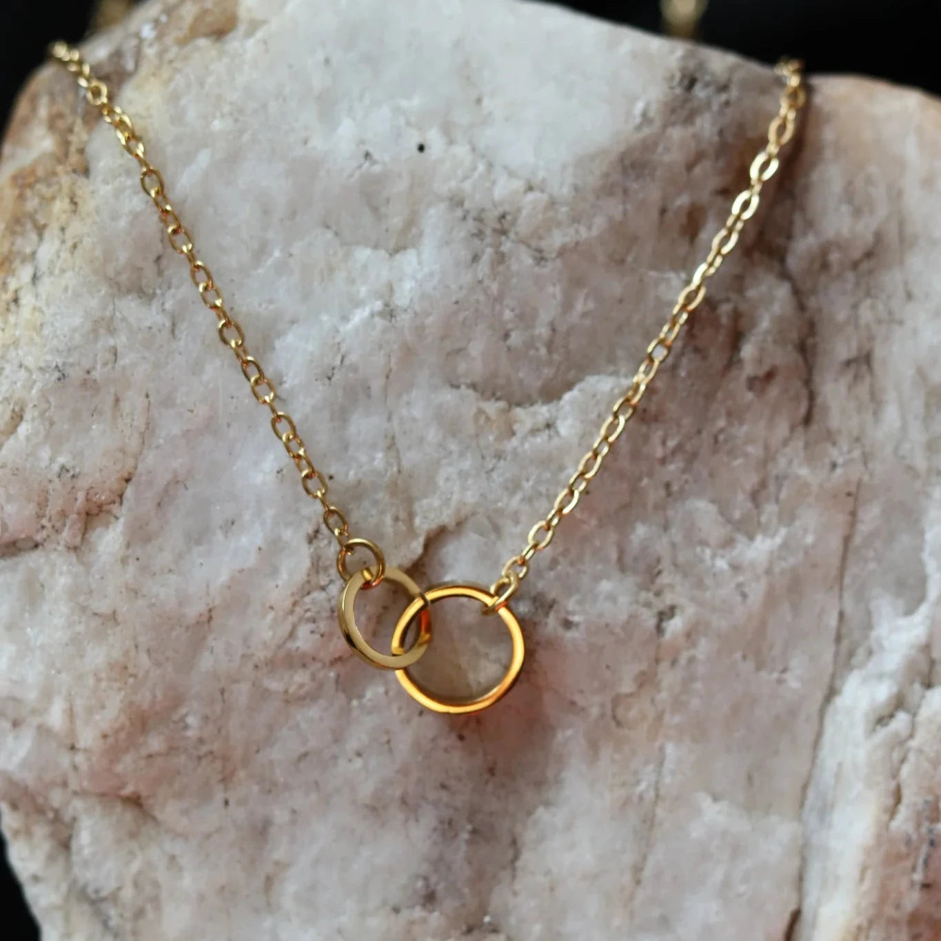 CN-129Daintygoldunitychainwithtwocirclesonarock1_1024x1024_2x_jpg_7117d95f-af81-4630-83c0-d19750d7b71c.webp