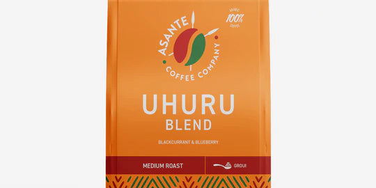 Asante Coffee Company Uhuru Blend coffee package with coffee beans on a white background