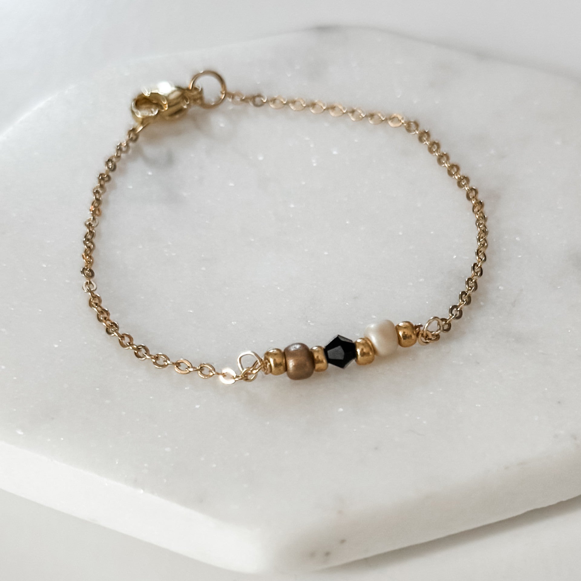 White, Gold, and Black Bead Bracelet - FMSCMarketplace.org