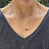 White, Gold, and Black Bead Necklace