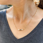 White, Gold, and Black Bead Necklace - FMSCMarketplace.org
