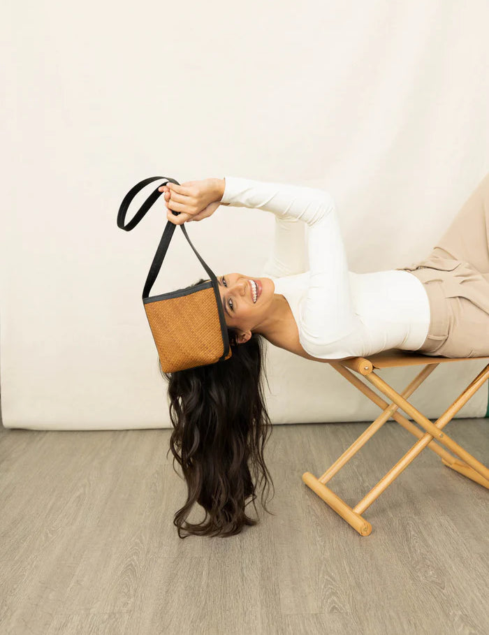 panye-crossbody-bag-spring-collection-model-lying-down_png.webp