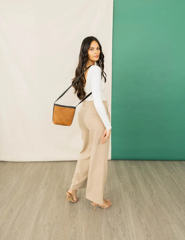 panye-crossbody-bag-spring-collection-model-walking_png.webp