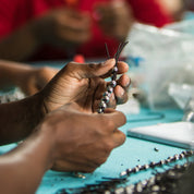 Artisan making braided leather hope bracelet
