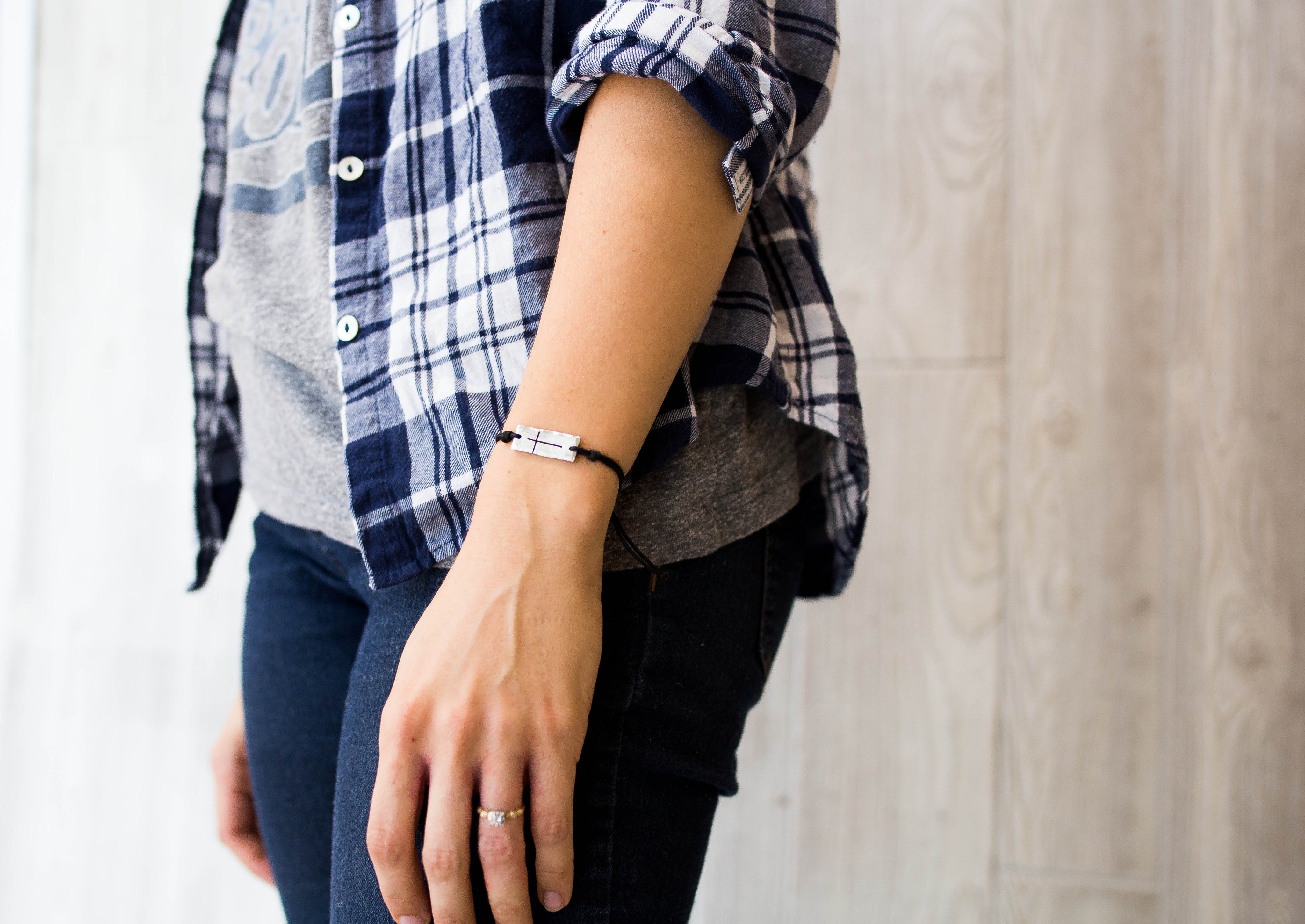 Pewter cross bracelet on model