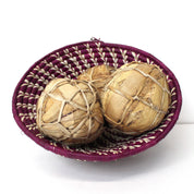 Banana leaf soccer balls in a basket